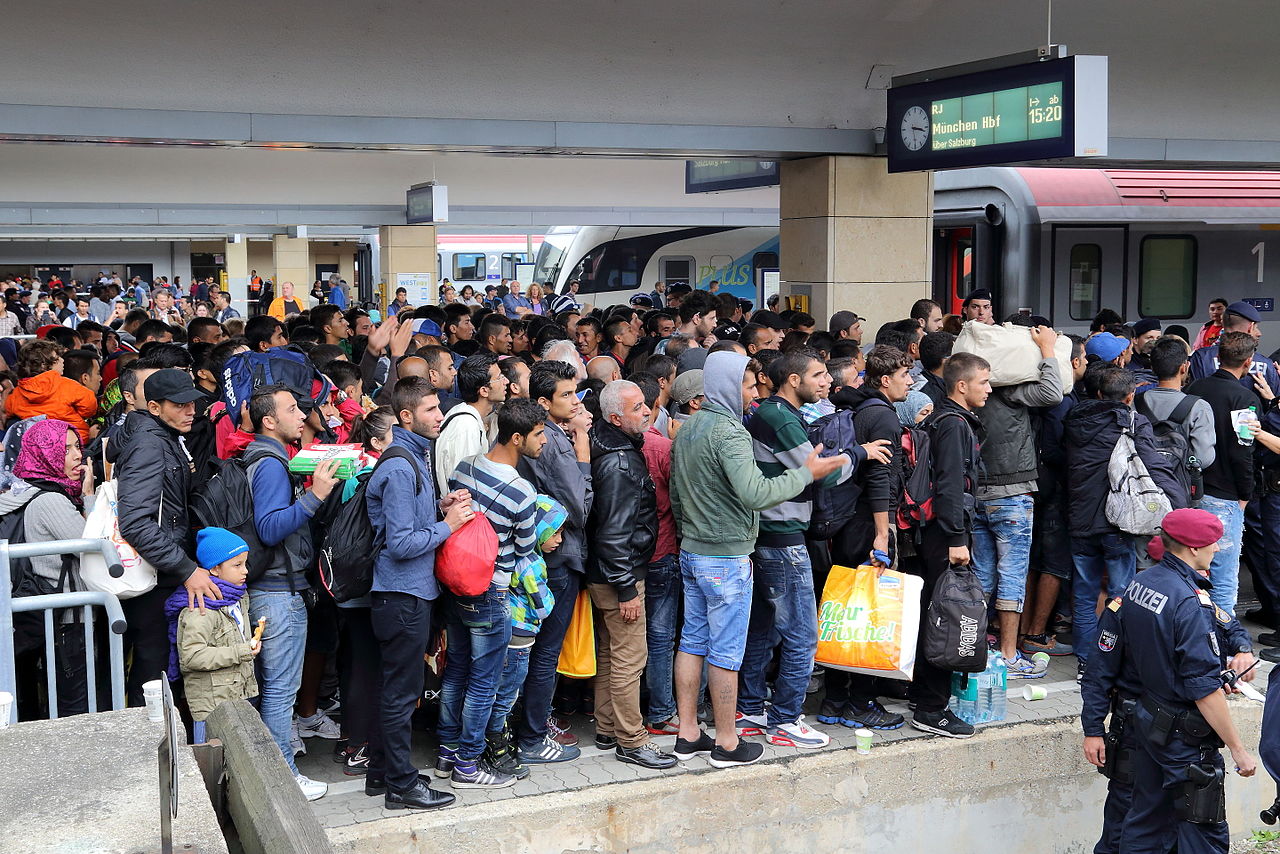 Refugees at the Vienna Westbanhof train station. By Bwag (Own work) [CC BY-SA 4.0 (https://creativecommons.org/licenses/by-sa/4.0)], via Wikimedia Commons