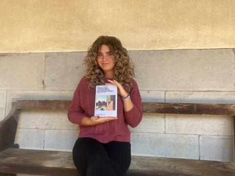 Hannah Atzwanger poses with Mariella Carrino's book.